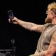 Jake Paul films himself on a phone during a public appearance amid fresh Canelo Alvarez fight speculation.