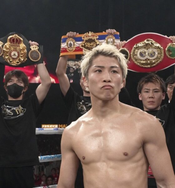 Naoya Inoue poses with world title belts at Tokyo Dome before facing Junto Nakatani