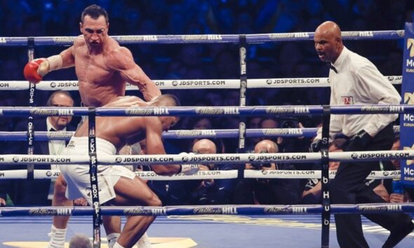 Wladimir Klitschko stands over Anthony Joshua after knocking him down during their heavyweight title fight at Wembley Stadium in 2017
