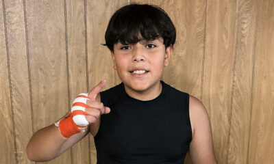 Anderson Aguilar poses in boxing training gear during his early journey in the sport