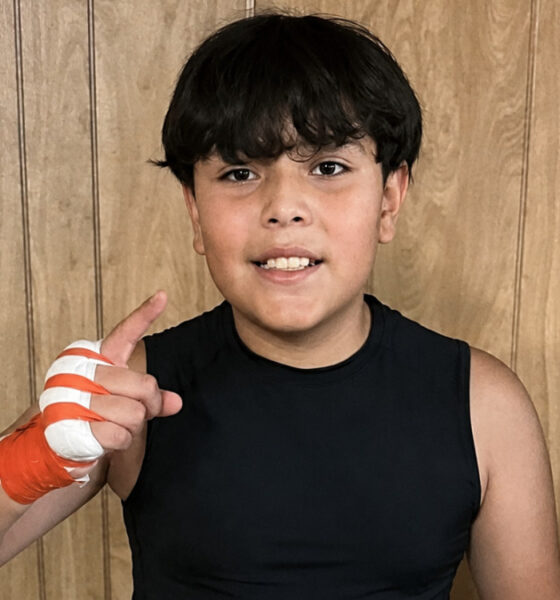 Anderson Aguilar poses in boxing training gear during his early journey in the sport