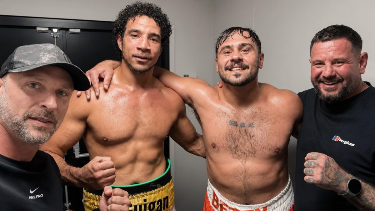 Dave Allen poses with Ross McGuigan and team members after their four-round heavyweight bout in Rotherham