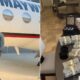 Floyd Mayweather stands beside a private jet while stacks of cash and luxury watches sit on a table amid growing scrutiny over the boxer's finances