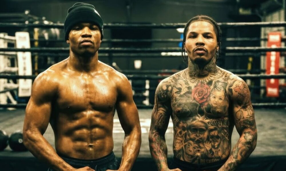 Floyd Schofield and Gervonta Davis pose in a boxing gym as negotiations continue following the WBA lightweight title order.
