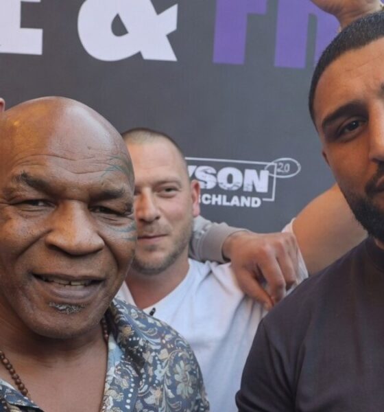 Mike Tyson poses with WBC mandatory heavyweight challenger Agit Kabayel as the German contender displays a championship belt during a public appearance in Germany