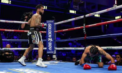 Oscar Collazo stands over Neider Valdez after scoring a knockdown during their flyweight bout in Oceanside, California