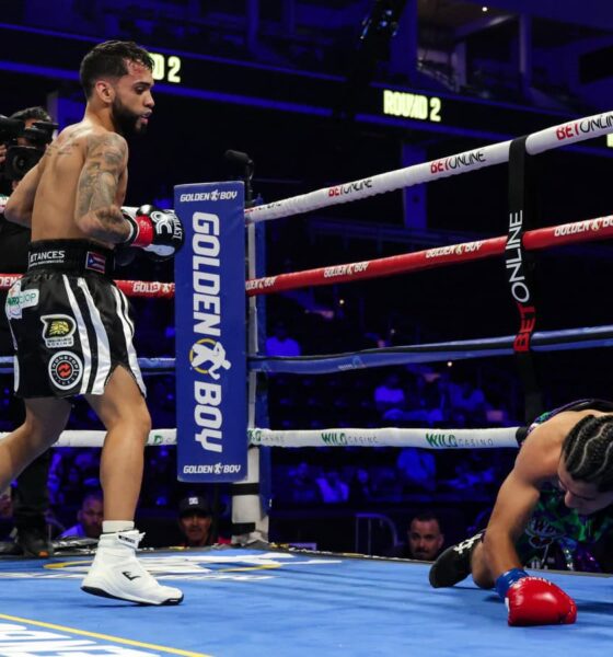 Oscar Collazo stands over Neider Valdez after scoring a knockdown during their flyweight bout in Oceanside, California