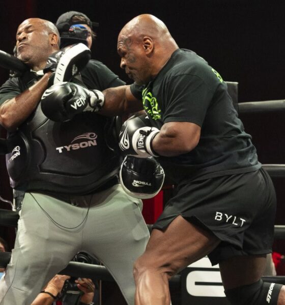 Mike Tyson lands a body shot on a trainer during a training session as the former heavyweight champion prepares for a potential return at nearly 60 years old