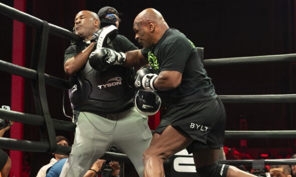 Mike Tyson lands a body shot on a trainer during a training session as the former heavyweight champion prepares for a potential return at nearly 60 years old