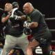 Mike Tyson lands a body shot on a trainer during a training session as the former heavyweight champion prepares for a potential return at nearly 60 years old
