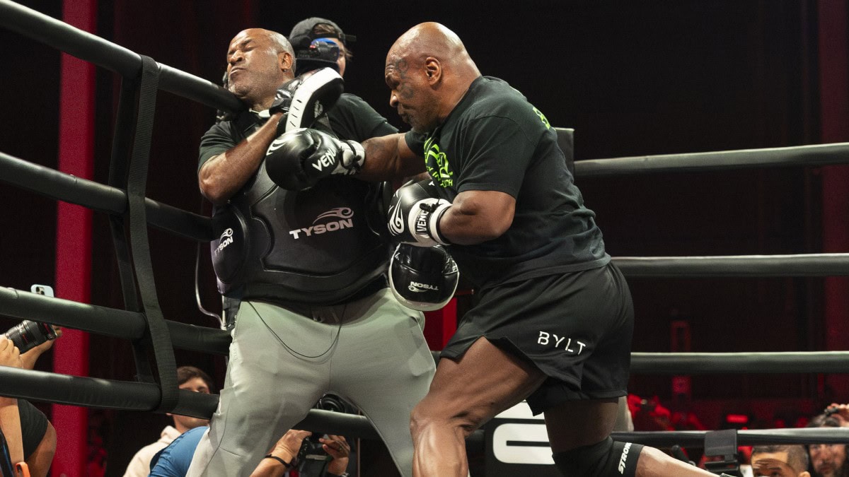 Mike Tyson lands a body shot on a trainer during a training session as the former heavyweight champion prepares for a potential return at nearly 60 years old