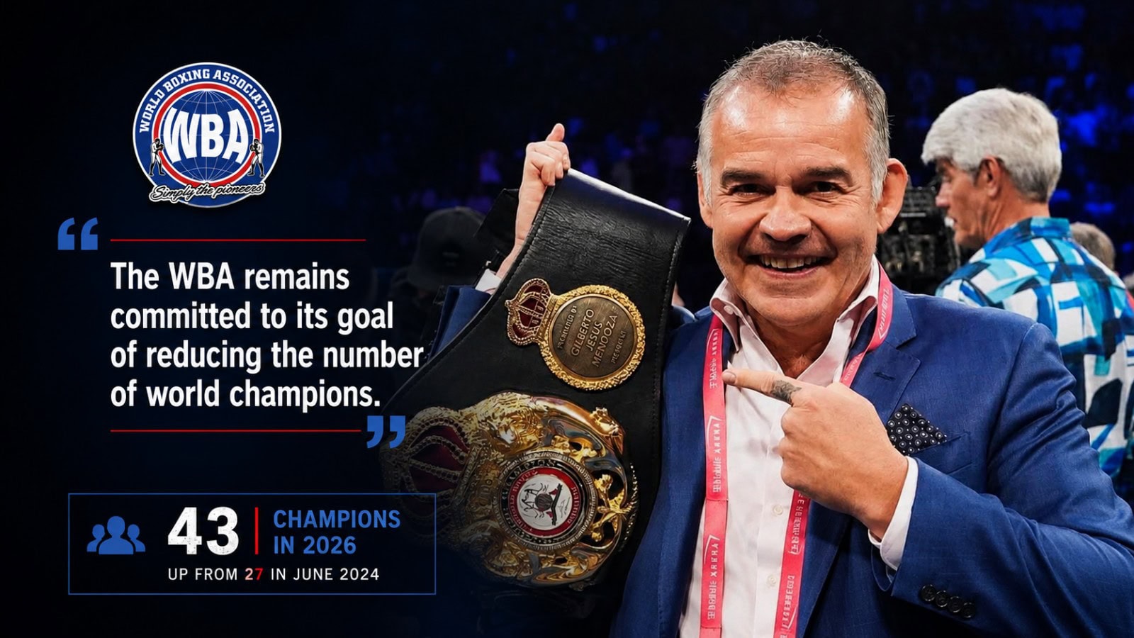 Gilberto Mendoza holding a WBA title belt inside a boxing ring during a championship presentation