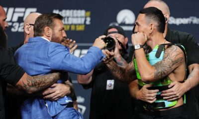 Conor McGregor slams Max Holloway&rsquo;s glasses to ground in intense UFC 329 staredown