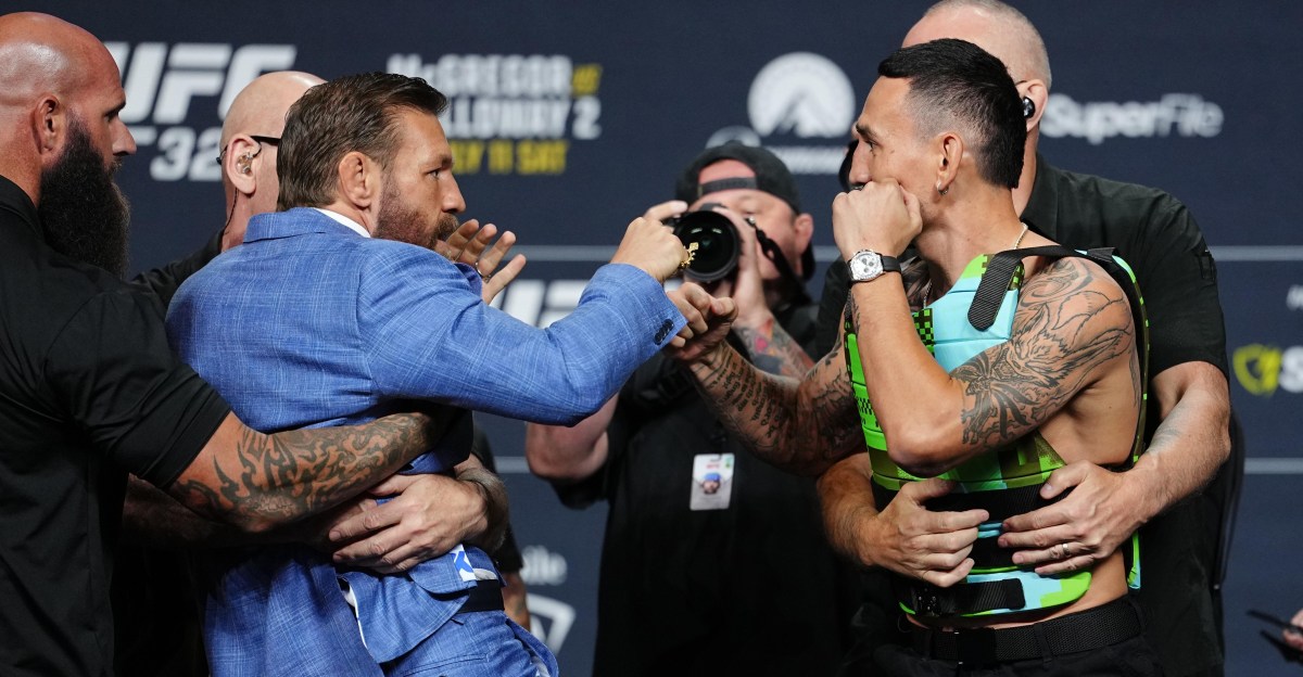 Conor McGregor slams Max Holloway&rsquo;s glasses to ground in intense UFC 329 staredown